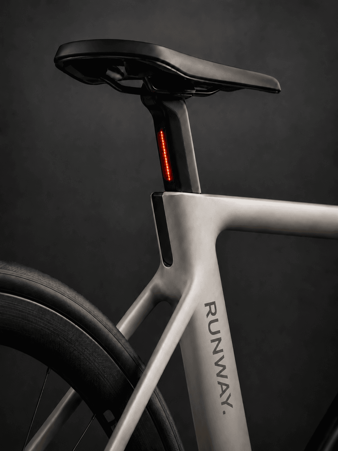 Runway road bike frame and seatpost detail showing an integrated LED taillight.